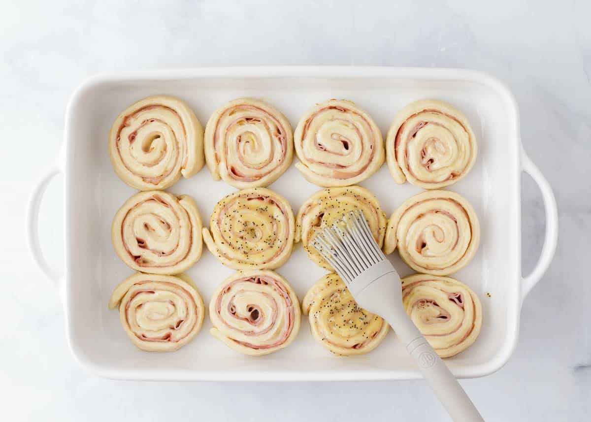 Baked Ham and Cheese Pinwheels with Dijon Poppy Seed Butter