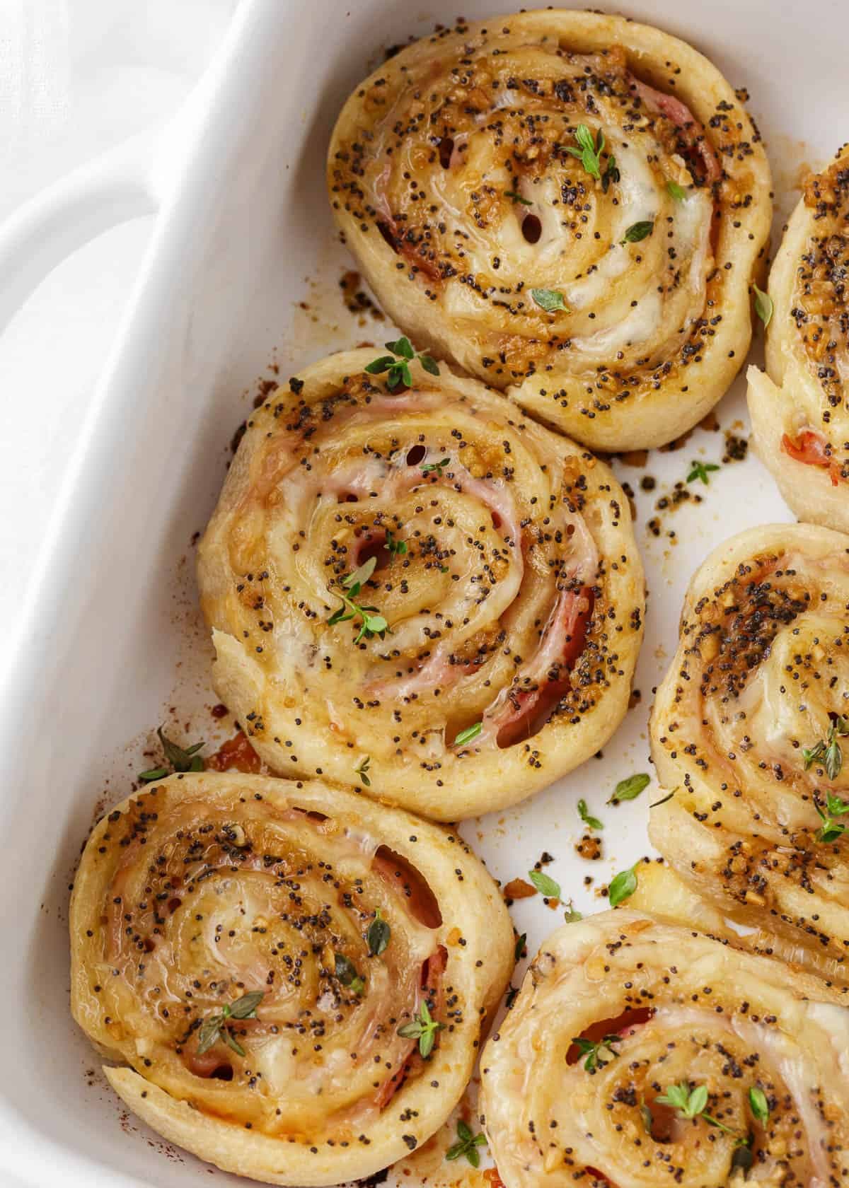 Baked Ham and Cheese Pinwheels with Dijon Poppy Seed Butter