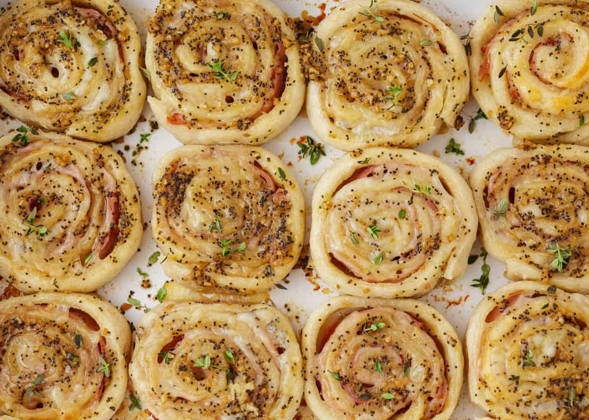 Baked Ham and Cheese Pinwheels with Dijon Poppy Seed Butter
